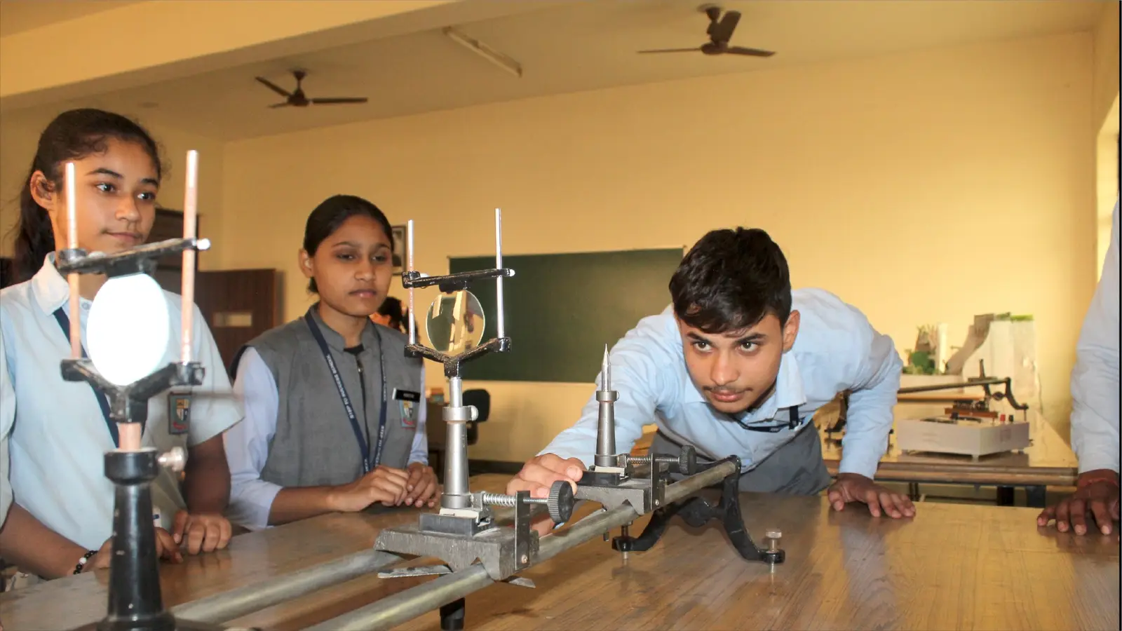Students working with equipment in the school science laboratory